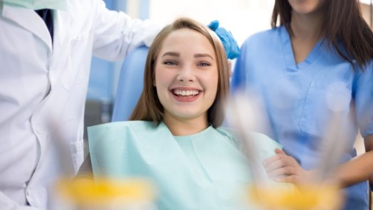 Young woman smiling at her dental checkup in Tulsa