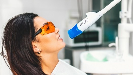 Woman receiving professional teeth whitening from Tulsa cosmetic dentist