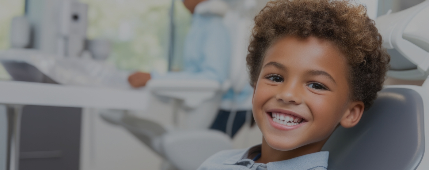 Young boy smiling while visiting childrens dentist in Tulsa