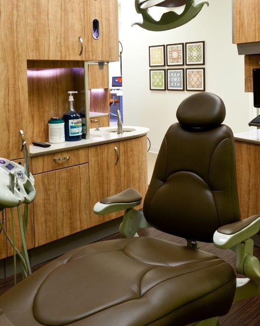 Black dental chair in dental office near Broken Arrow Oklahoma