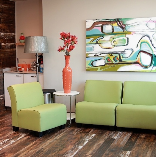 Light green armchairs in dental office waiting room