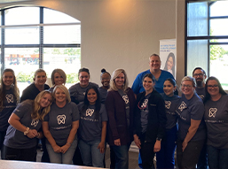 Glisten Dental Care of Tulsa team members wearing matching T shirts