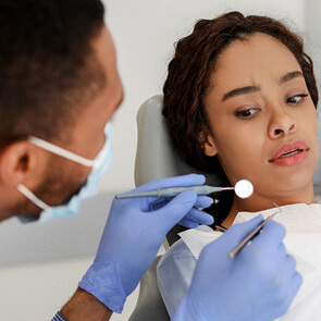 woman afraid in the dental chair