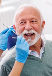 Mature man smiling during dental checkup