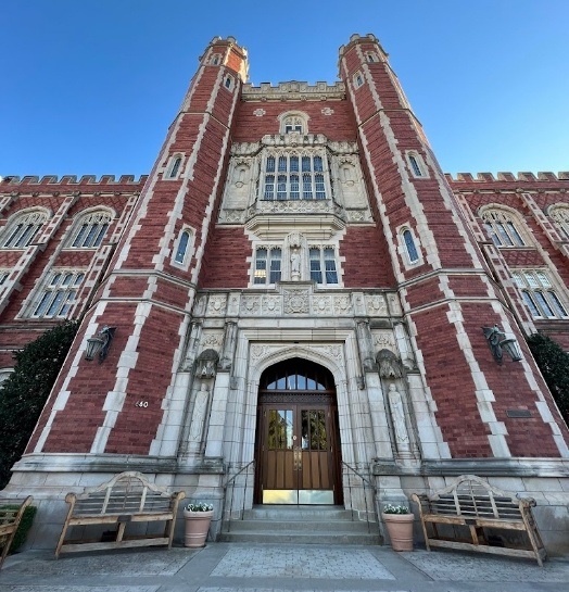 Front of red and white building at the University of Oklahoma College of Dentistry