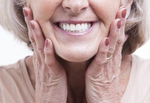 Both dental implants and dentures offer unique advantages. Learn what option is right for you from your trusted dentist in Tulsa, Dr. Angie Nauman. 