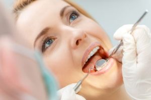 Woman getting a dental exam 