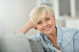 older woman smiling with blonde hair