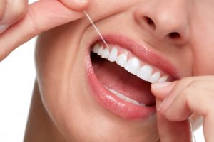 Woman flossing