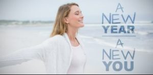 Smiling woman with sign that reads, "New Year, New You"