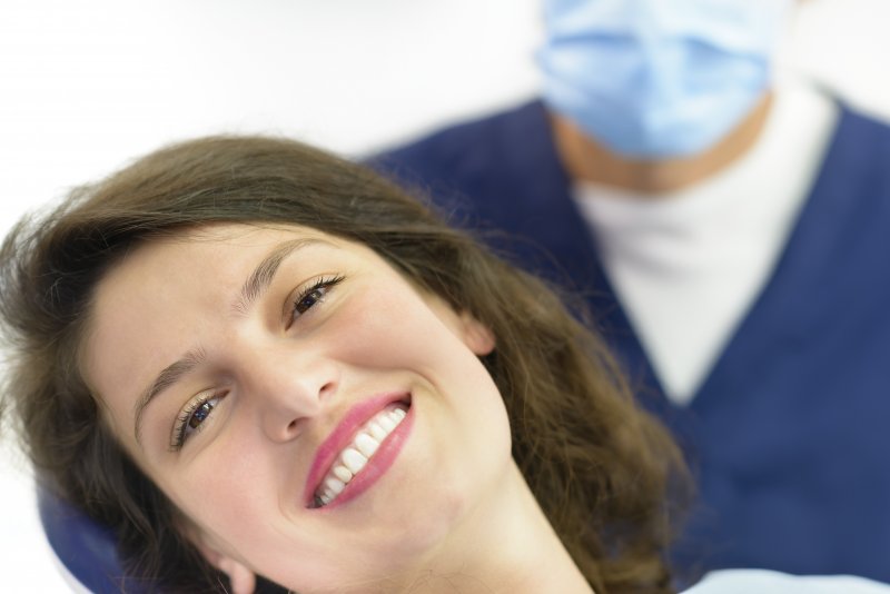 patient smiling with porcelain veneers