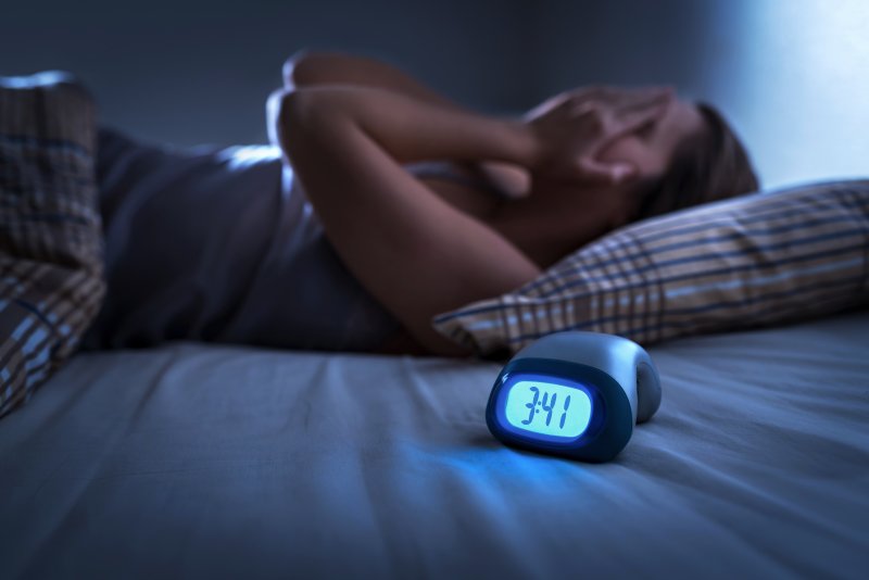 woman struggling with sleep apnea