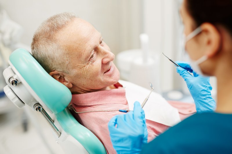 A senior man visiting his cosmetic dentist